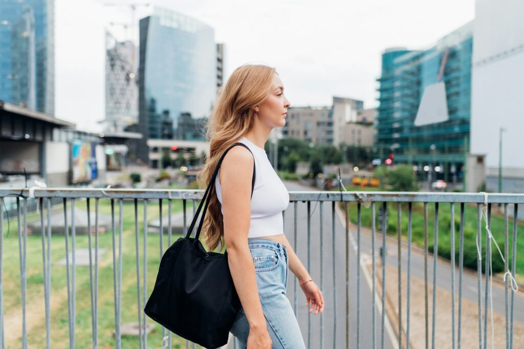 Young woman caucasian walking outdoor going to work
